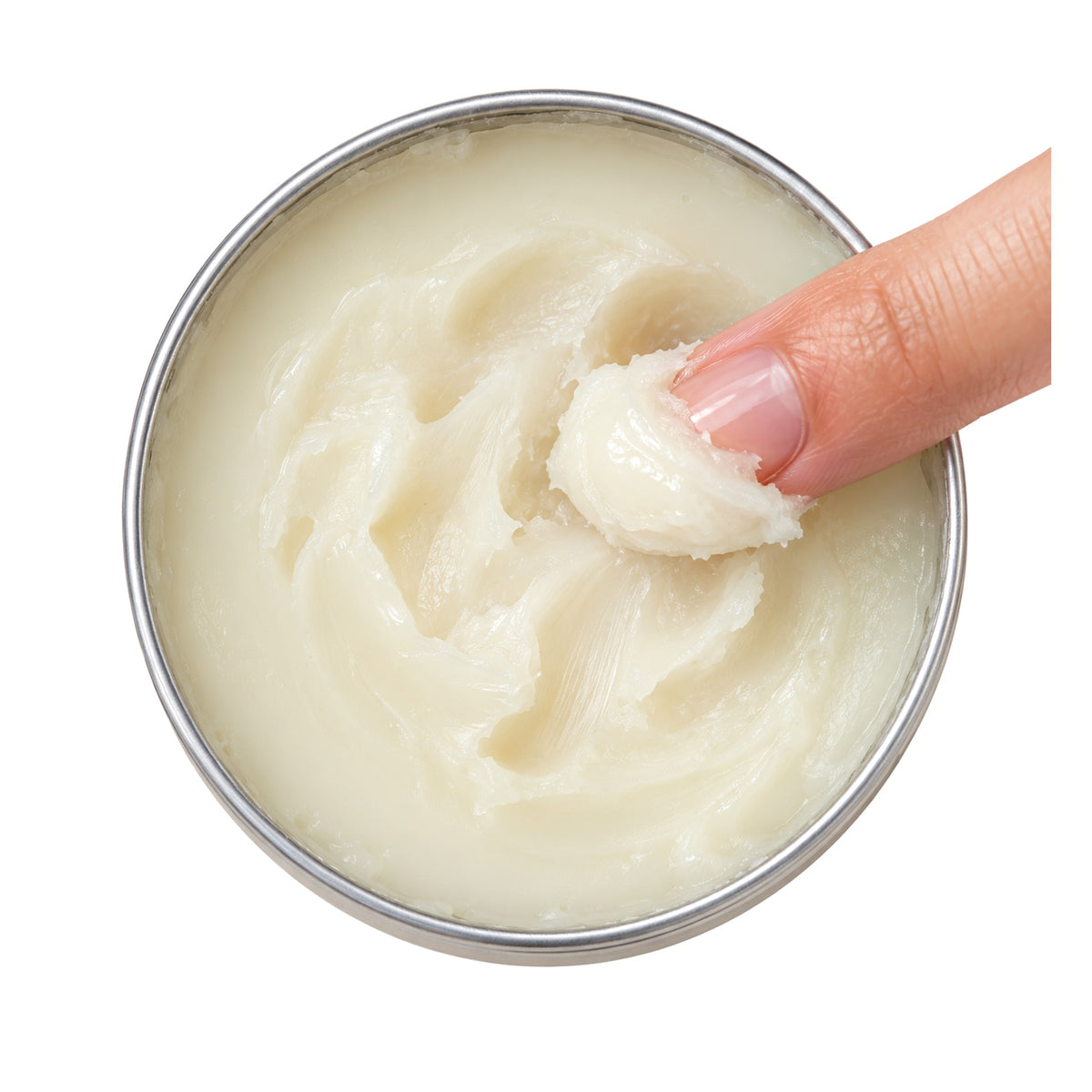 Close-up of CapeLilly calendula salve texture with a fingertip scoop